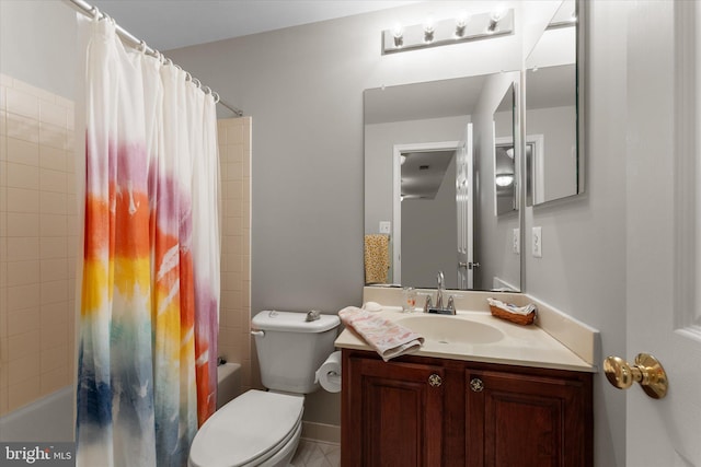 bathroom with shower / bath combo, vanity, toilet, and baseboards