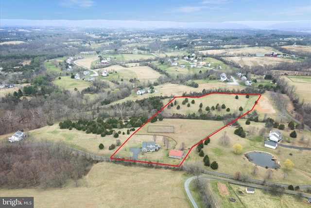 aerial view of sparsely populated area featuring property parcel outlined