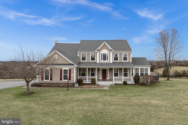 view of front of house featuring covered porch, a chimney, and a shingled roof