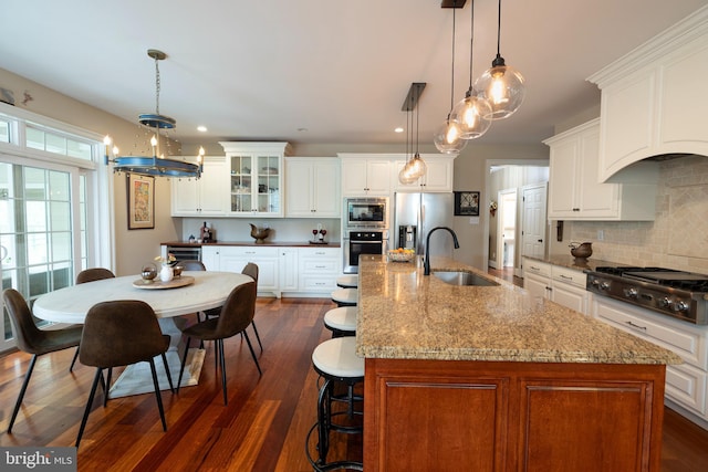 8 Fallbrook Ln, Glen Mills, PA 19342 - kitchen featuring a sink, appliances with stainless steel finishes, a center island with sink, tasteful backsplash, and recessed lighting