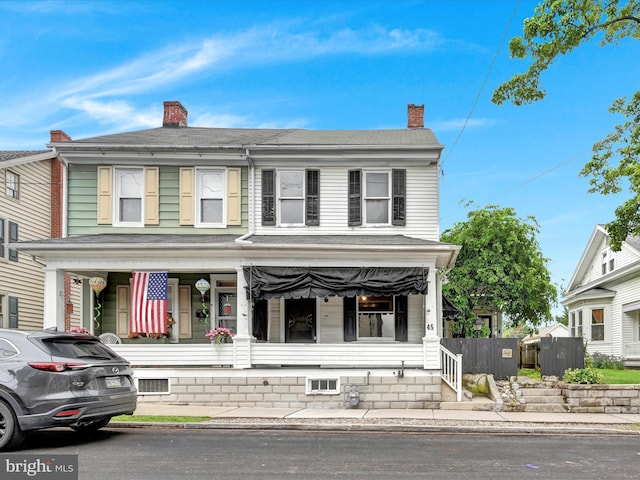 45 Front St, Lititz, PA 17543 - view of front of property with a porch, a chimney, and a shingled roof