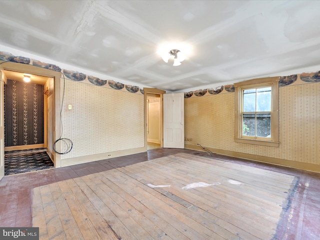 45 Front St, Lititz, PA 17543 - empty room with wallpapered walls, wood-type flooring, and baseboards