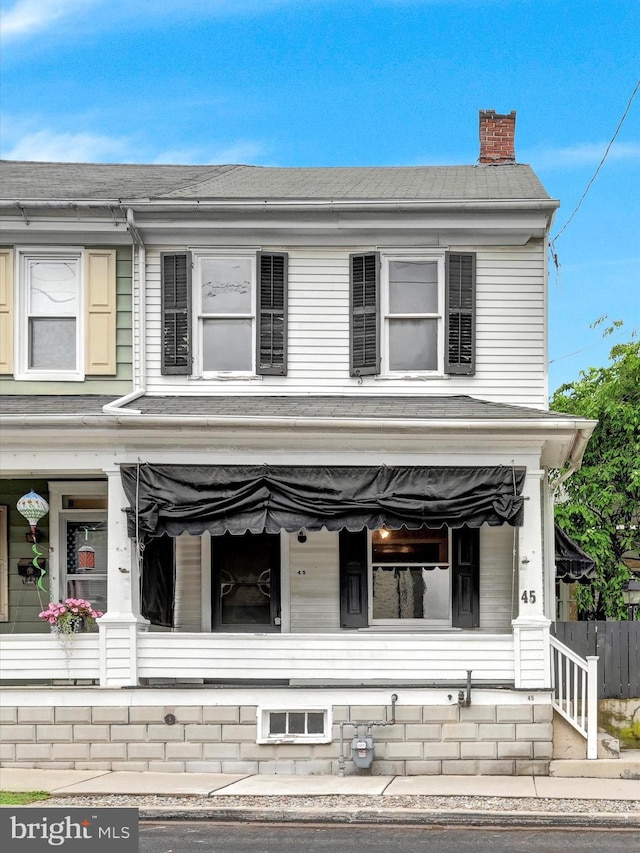 45 Front St, Lititz, PA 17543 - view of front of home featuring a porch and a chimney