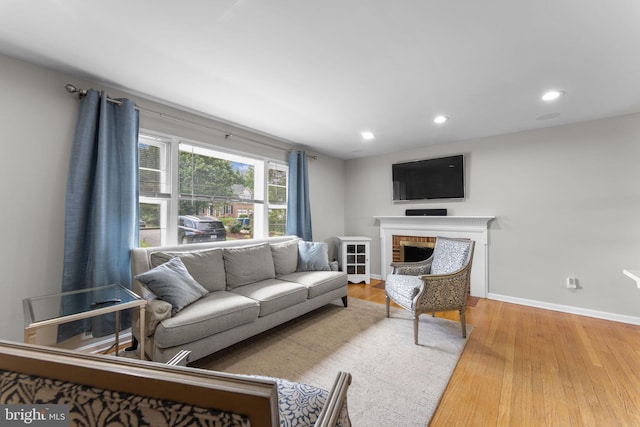 8313 Accotink Rd, Lorton, VA 22079 - living room featuring baseboards, wood finished floors, a brick fireplace, and recessed lighting