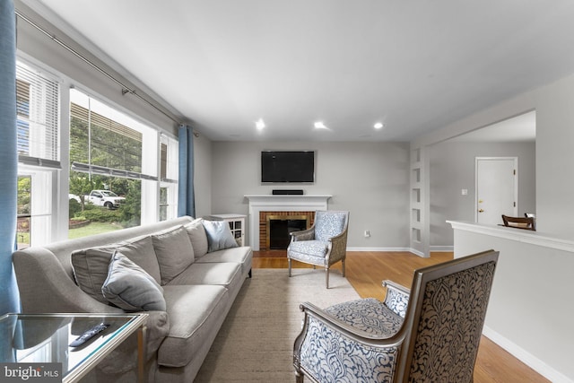 8313 Accotink Rd, Lorton, VA 22079 - living room featuring wood finished floors, recessed lighting, a fireplace, and baseboards