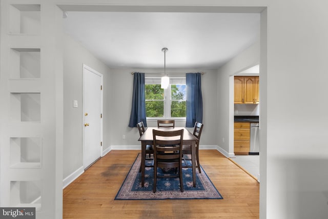 8313 Accotink Rd, Lorton, VA 22079 - dining room featuring light wood-type flooring and baseboards