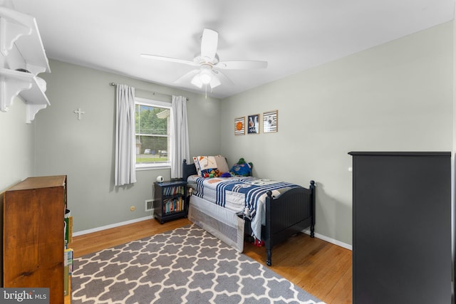 8313 Accotink Rd, Lorton, VA 22079 - bedroom with wood finished floors, baseboards, and a ceiling fan
