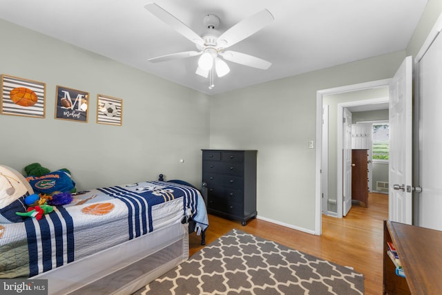 8313 Accotink Rd, Lorton, VA 22079 - bedroom with wood finished floors, baseboards, and ceiling fan