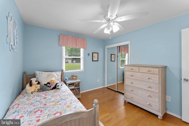 8313 Accotink Rd, Lorton, VA 22079 - bedroom featuring light wood-style flooring, a ceiling fan, and baseboards
