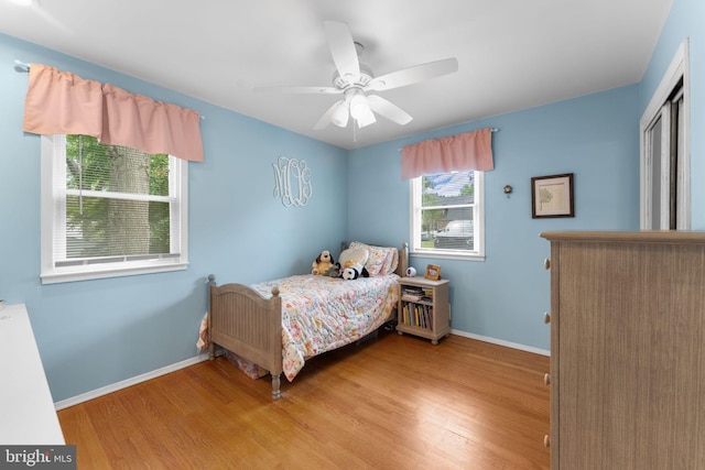 8313 Accotink Rd, Lorton, VA 22079 - bedroom with light wood-type flooring, baseboards, and ceiling fan
