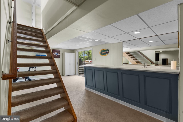 8313 Accotink Rd, Lorton, VA 22079 - bar area with light colored carpet, stairway, a paneled ceiling, recessed lighting, and a sink
