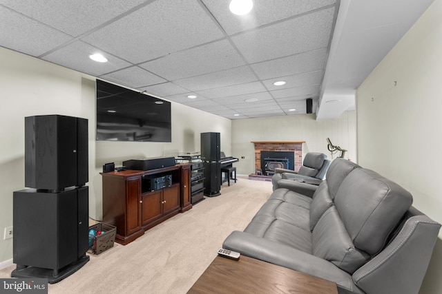 8313 Accotink Rd, Lorton, VA 22079 - living room with light colored carpet, recessed lighting, a fireplace, and a paneled ceiling