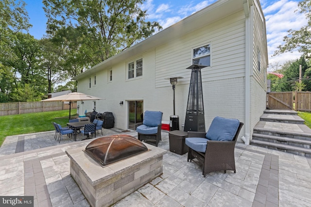 8313 Accotink Rd, Lorton, VA 22079 - view of patio featuring a fire pit and a gate