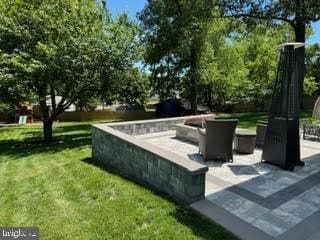8313 Accotink Rd, Lorton, VA 22079 - view of property's community featuring a lawn and a patio