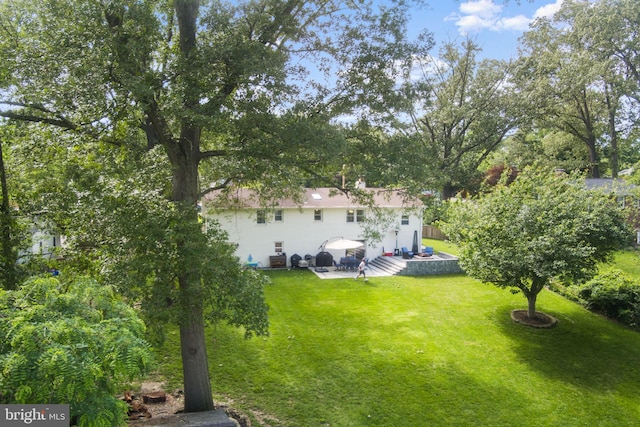 8313 Accotink Rd, Lorton, VA 22079 - view of green lawn with a patio area