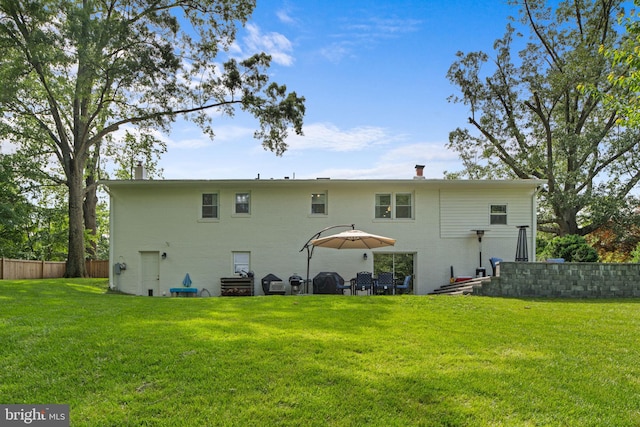 8313 Accotink Rd, Lorton, VA 22079 - rear view of house featuring a chimney and brick siding