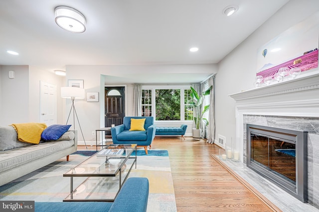 600 Saint Andrews Ln, Silver Spring, MD 20901 - living room featuring wood finished floors, a premium fireplace, baseboards, and recessed lighting