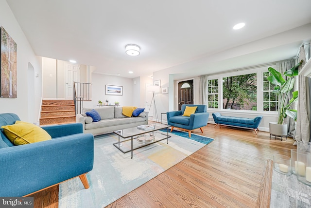 600 Saint Andrews Ln, Silver Spring, MD 20901 - living area with stairway, wood finished floors, arched walkways, recessed lighting, and baseboards