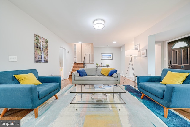 600 Saint Andrews Ln, Silver Spring, MD 20901 - living area featuring stairs, arched walkways, wood finished floors, baseboards, and recessed lighting