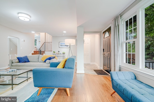 600 Saint Andrews Ln, Silver Spring, MD 20901 - living room with light wood finished floors, healthy amount of natural light, stairs, baseboards, and recessed lighting