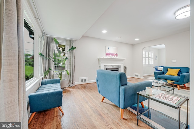 600 Saint Andrews Ln, Silver Spring, MD 20901 - living area with light wood-type flooring, baseboards, arched walkways, a fireplace, and recessed lighting