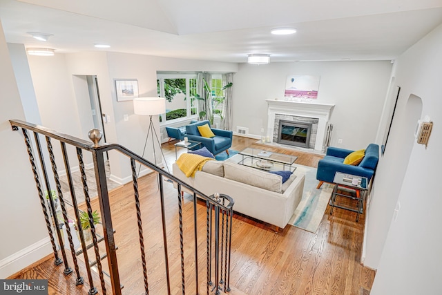600 Saint Andrews Ln, Silver Spring, MD 20901 - living room with light wood-style floors, a glass covered fireplace, baseboards, lofted ceiling, and recessed lighting