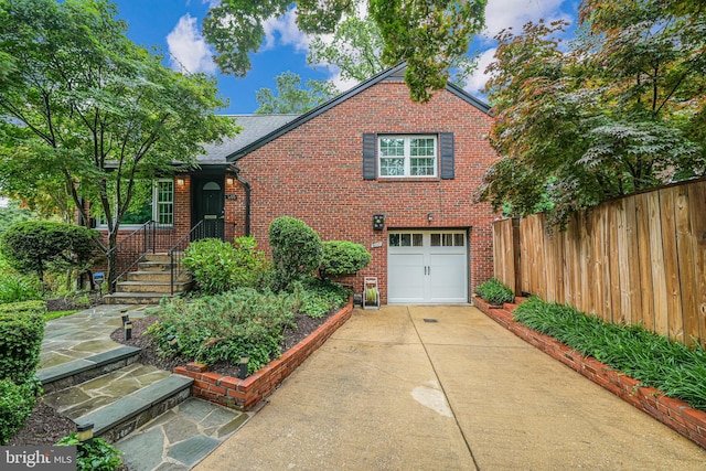 600 Saint Andrews Ln, Silver Spring, MD 20901 - tudor home featuring concrete driveway, brick siding, and a garage