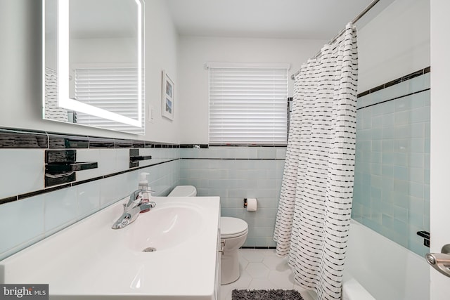 600 Saint Andrews Ln, Silver Spring, MD 20901 - full bathroom with toilet, tile patterned flooring, shower / tub combo with curtain, vanity, and tile walls