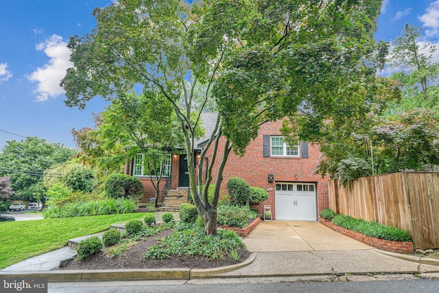 600 Saint Andrews Ln, Silver Spring, MD 20901 - view of front of property with brick siding, an attached garage, and driveway