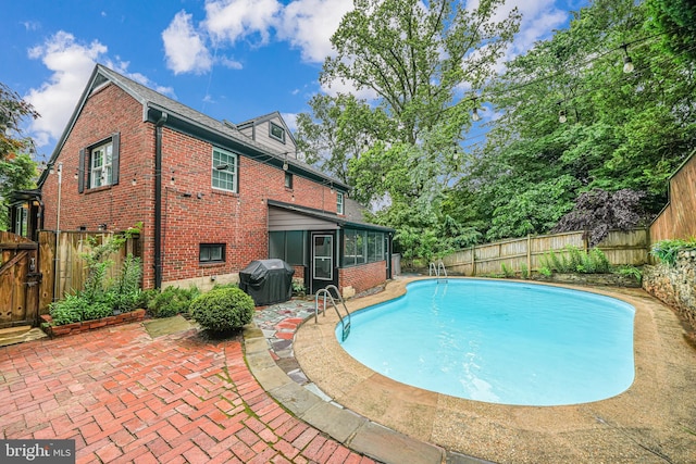 600 Saint Andrews Ln, Silver Spring, MD 20901 - view of swimming pool featuring a sunroom, area for grilling, a fenced backyard, a patio area, and a gate
