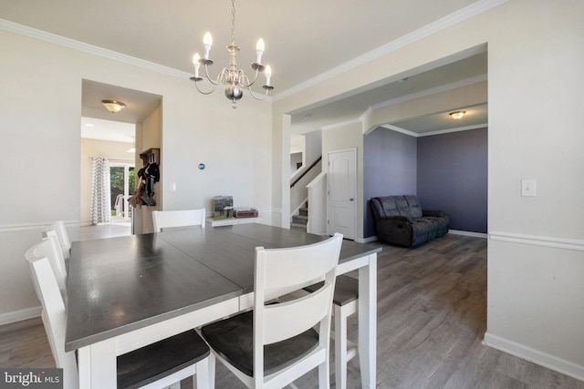 430 Mcwharton Way, Bunker Hill, WV 25413 - dining room featuring a chandelier, stairs, wood finished floors, crown molding, and baseboards
