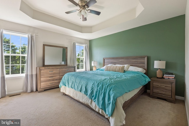430 Mcwharton Way, Bunker Hill, WV 25413 - bedroom featuring light carpet, a tray ceiling, baseboards, and ceiling fan