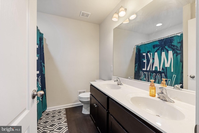 430 Mcwharton Way, Bunker Hill, WV 25413 - bathroom featuring baseboards, toilet, wood finished floors, and double vanity