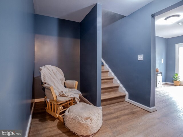 107 Arbutis Trl, Star Tannery, VA 22654 - sitting room featuring wood finished floors, baseboards, and stairs