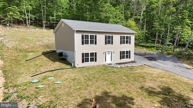 107 Arbutis Trl, Star Tannery, VA 22654 - view of front facade with a view of trees, a front lawn, and central AC