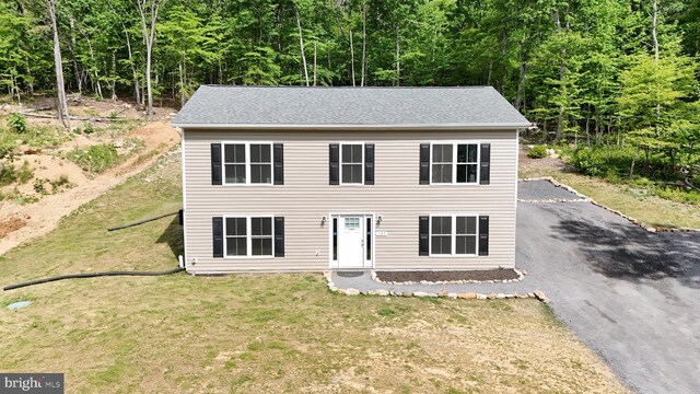 107 Arbutis Trl, Star Tannery, VA 22654 - view of front of home with a front lawn, a forest view, and driveway