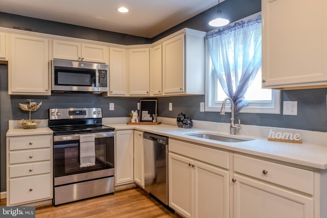 107 Arbutis Trl, Star Tannery, VA 22654 - kitchen featuring appliances with stainless steel finishes, a sink, light countertops, white cabinets, and recessed lighting