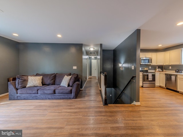 107 Arbutis Trl, Star Tannery, VA 22654 - living area with light wood-style floors, recessed lighting, and baseboards