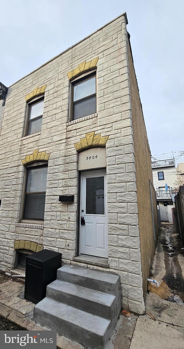 3404 Mueller St, Baltimore, MD 21224 - multi unit property featuring entry steps and stone siding