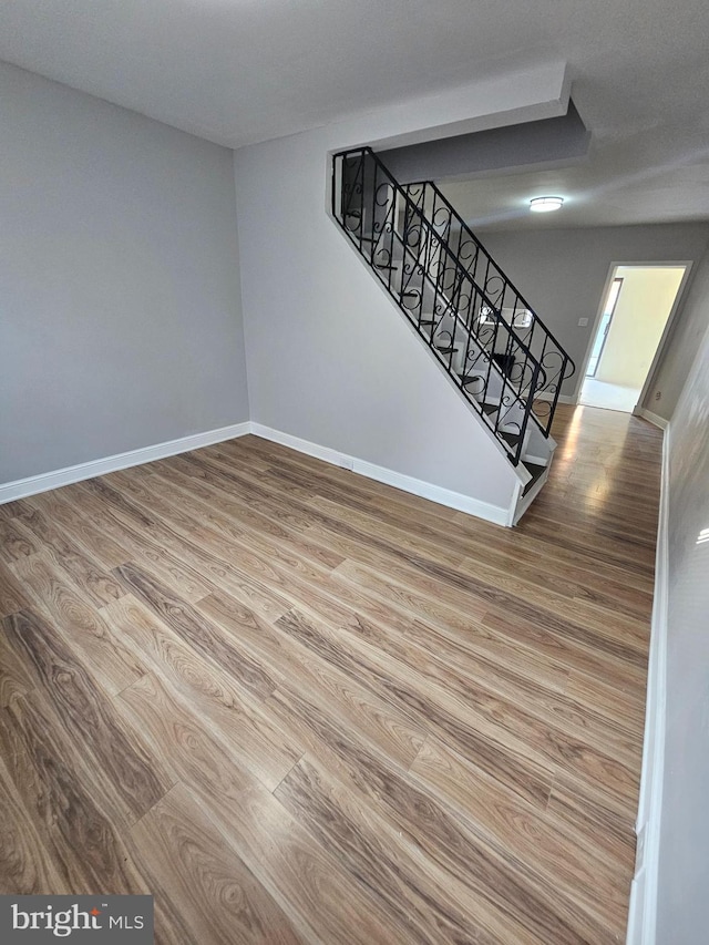 3404 Mueller St, Baltimore, MD 21224 - staircase featuring wood finished floors and baseboards