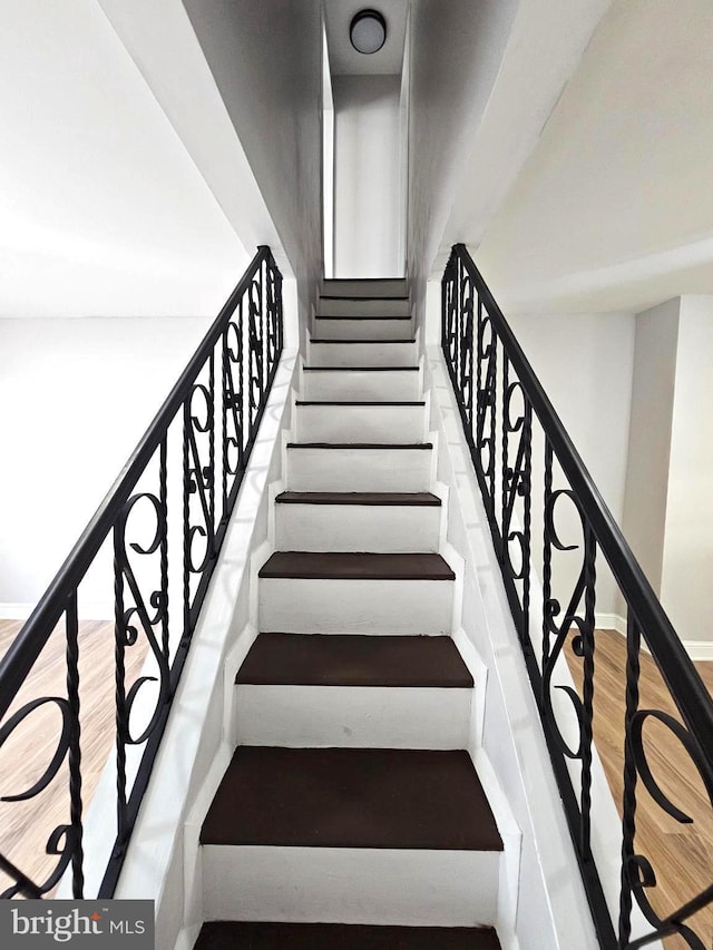 3404 Mueller St, Baltimore, MD 21224 - stairs with wood finished floors and baseboards