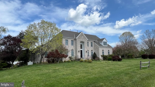 16200 Bellingham Dr, Darnestown, MD 20874 - view of front of house with a front yard, brick siding, and roof with shingles