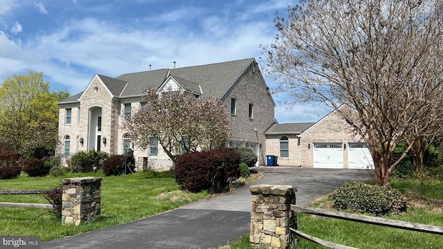 16200 Bellingham Dr, Darnestown, MD 20874 - french provincial home with brick siding, driveway, and a garage