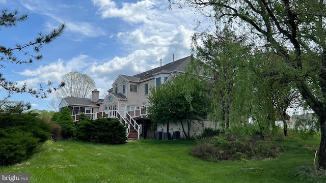 16200 Bellingham Dr, Darnestown, MD 20874 - rear view of property featuring stairs, a yard, and a wooden deck
