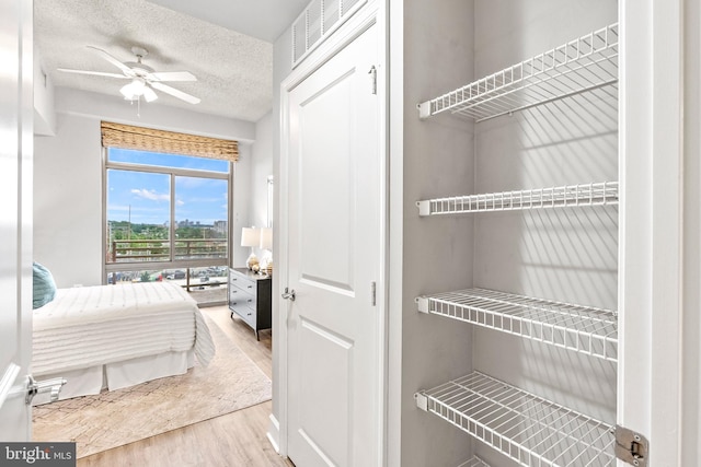 3600 S Glebe Rd Unit 605W, Arlington, VA 22202 - bedroom featuring wood finished floors and a textured ceiling