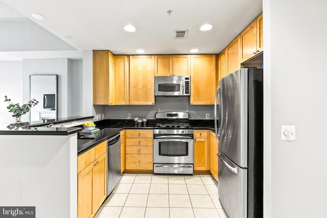 3600 S Glebe Rd Unit 605W, Arlington, VA 22202 - kitchen featuring stainless steel appliances, light tile patterned floors, a peninsula, dark countertops, and recessed lighting