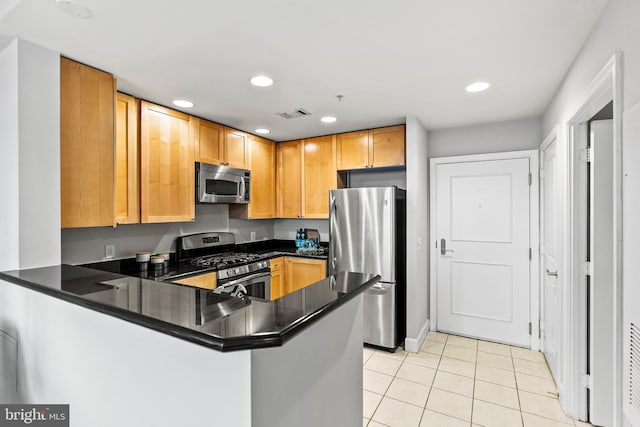 3600 S Glebe Rd Unit 605W, Arlington, VA 22202 - kitchen with stainless steel appliances, a peninsula, light tile patterned flooring, dark countertops, and recessed lighting
