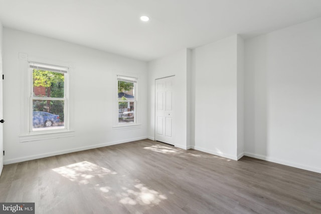 707 S Braddock St, Winchester, VA 22601 - unfurnished bedroom featuring wood finished floors, baseboards, a closet, and recessed lighting