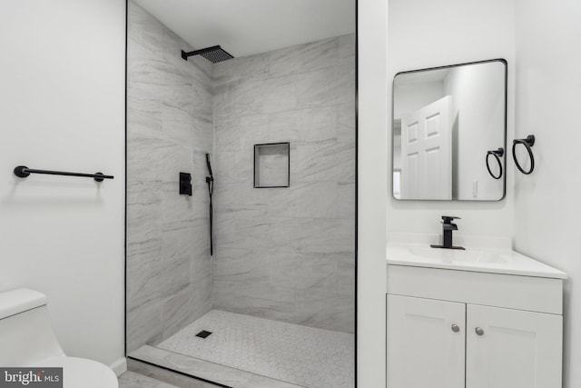 707 S Braddock St, Winchester, VA 22601 - bathroom with toilet, vanity, and tiled shower