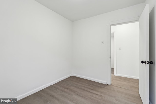 707 S Braddock St, Winchester, VA 22601 - empty room with wood finished floors and baseboards